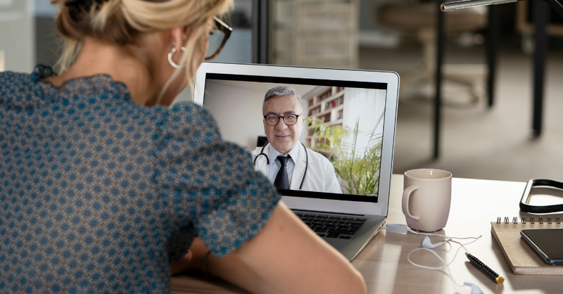 Medical-team reviewing diagnostic-imaging on a large-screen display during a collaborative-meeting in a healthcare environment