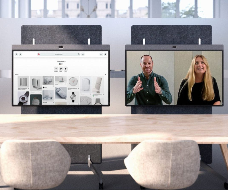 Modern office setup with dual screens for video conferencing, displaying a product presentation and a virtual meeting with two participants for seamless collaboration